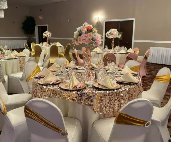 A banquet table fully decorated in a ballroom