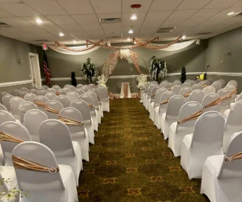 A banquet table fully decorated in a ballroom