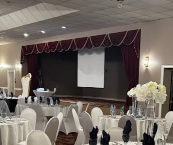 A banquet table fully decorated in a ballroom