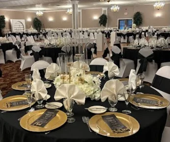 A banquet table fully decorated in a ballroom